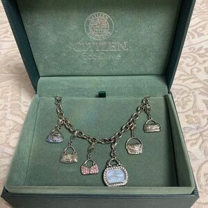 Citizen Ladies Blue Mother Of Pearl Purse Charm Watch Eco-Drive with Swarovski.